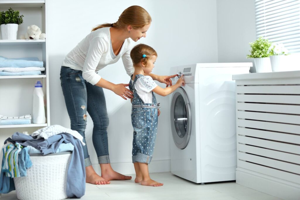 mother and child doing laundry